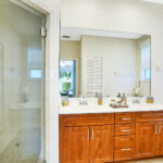 Washroom with sink and glass door