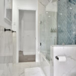 Luxury washroom with blue glass wall