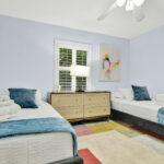 Two White Beds In a Room