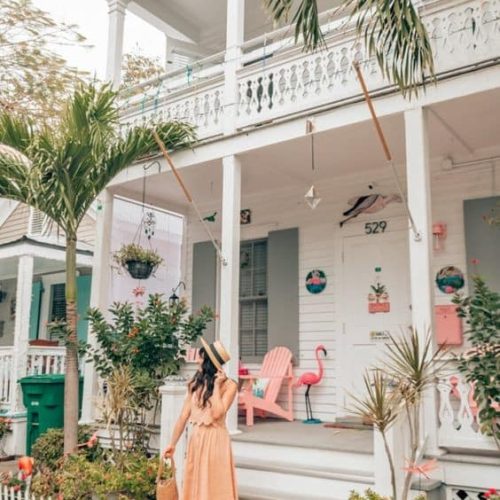 A woman standing on the steps of house